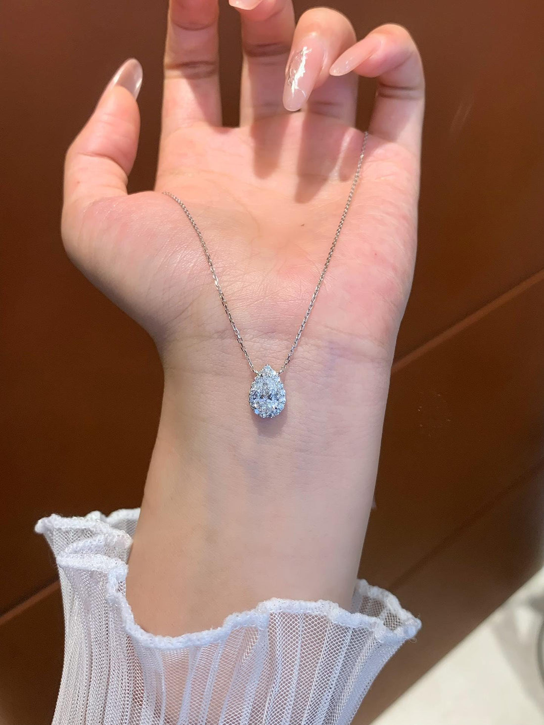 Impossible to Look Away Pear Moissanite Halo Pendant