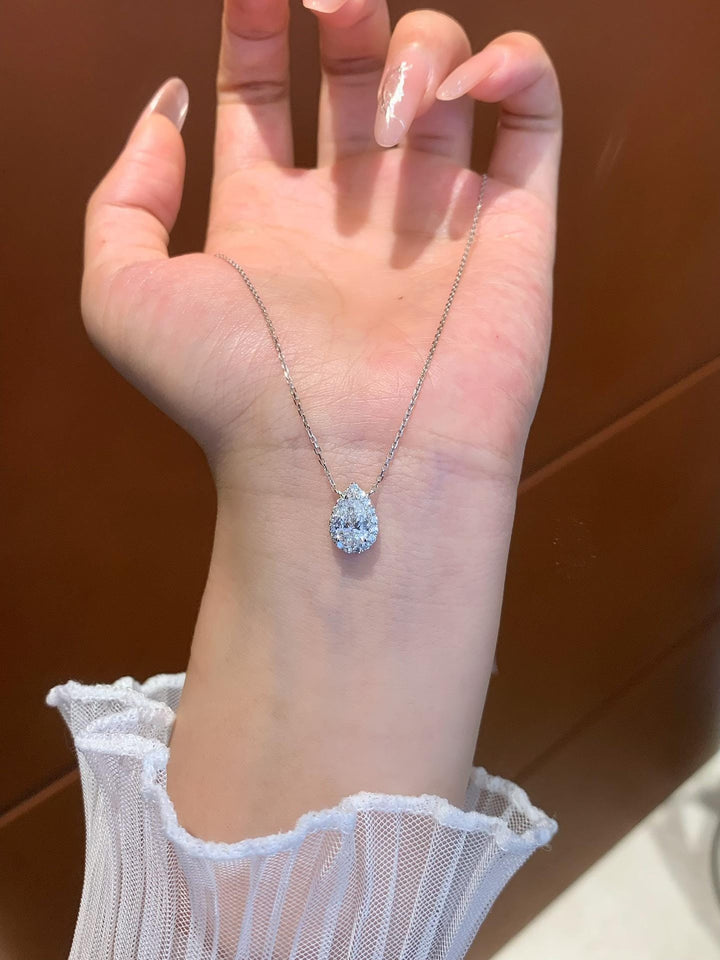 Impossible to Look Away Pear Moissanite Halo Pendant