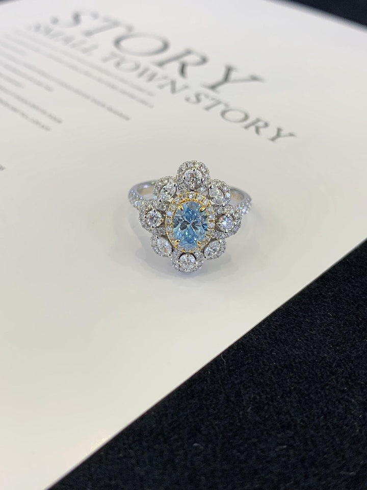 Made to Be Noticed Oval Blue Stone Floral Halo Ring