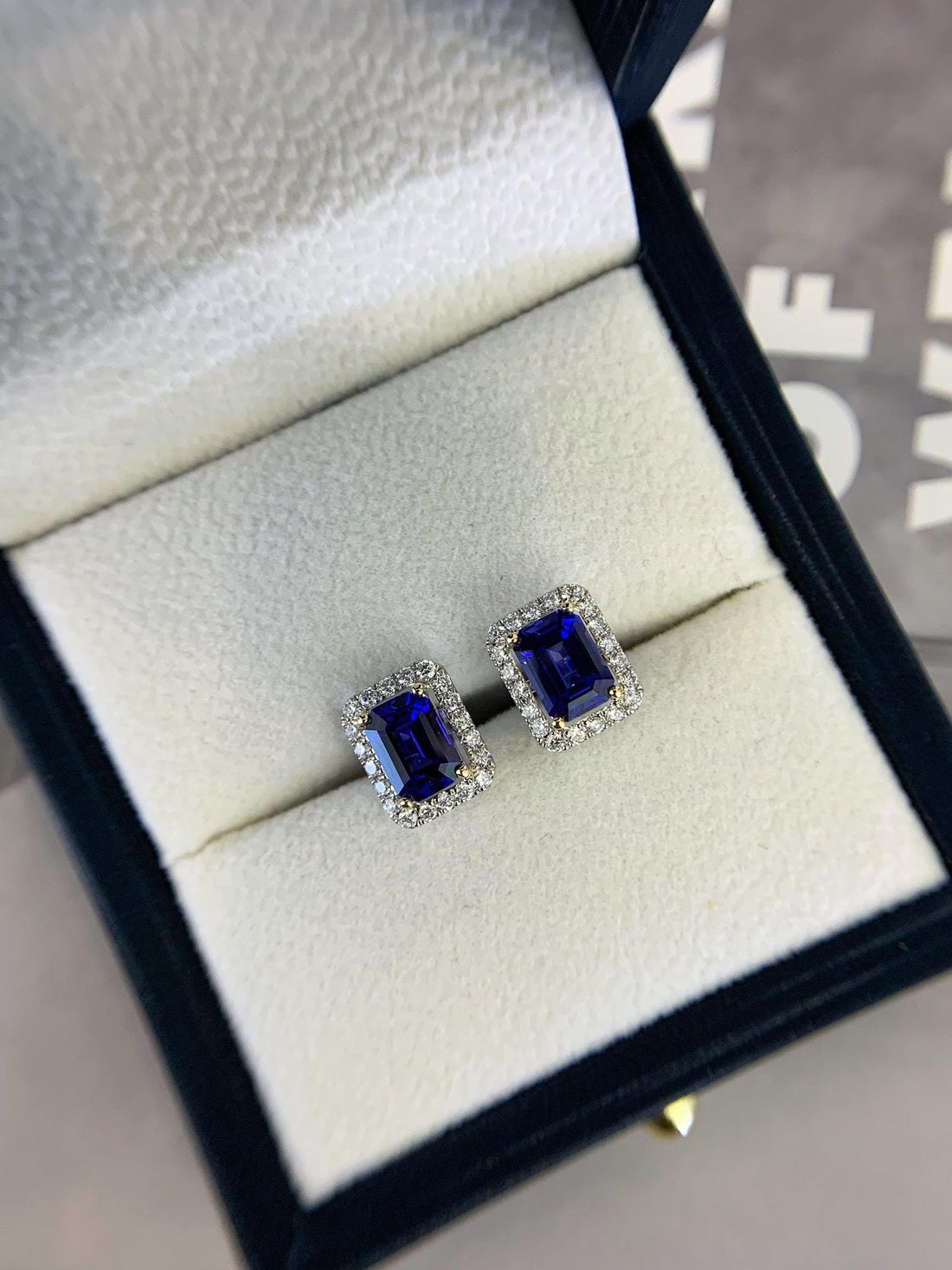 Light You Can Wear Emerald Cut Sapphire Halo Studs