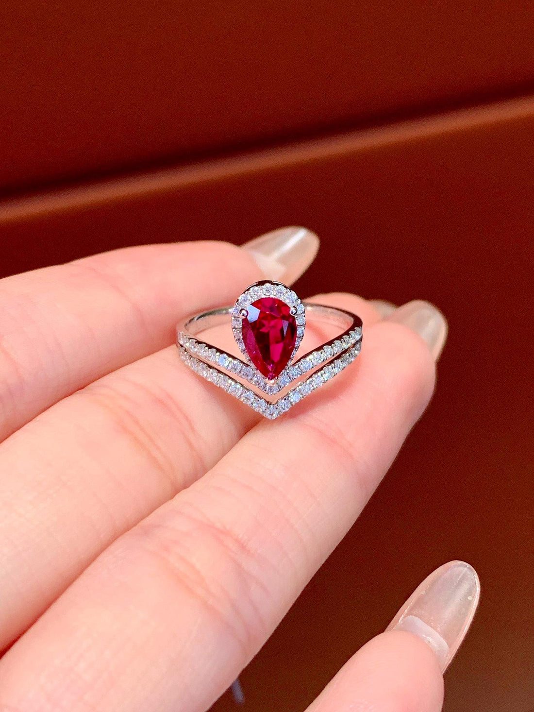 Pure Brilliance Oval Ruby Ring with Diamond Wrap
